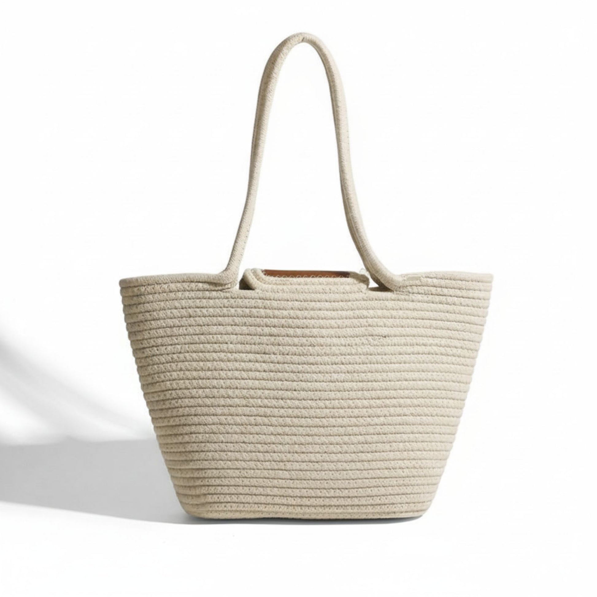 Beige woven tote bag on a white background - Dotflakes