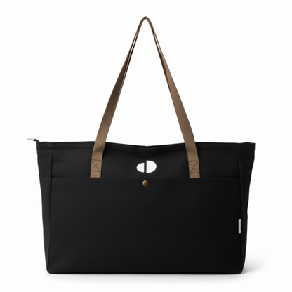 Black tote bag with brown straps on a white background