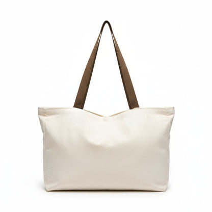 Beige tote bag with brown straps on a white background - Dotflakes